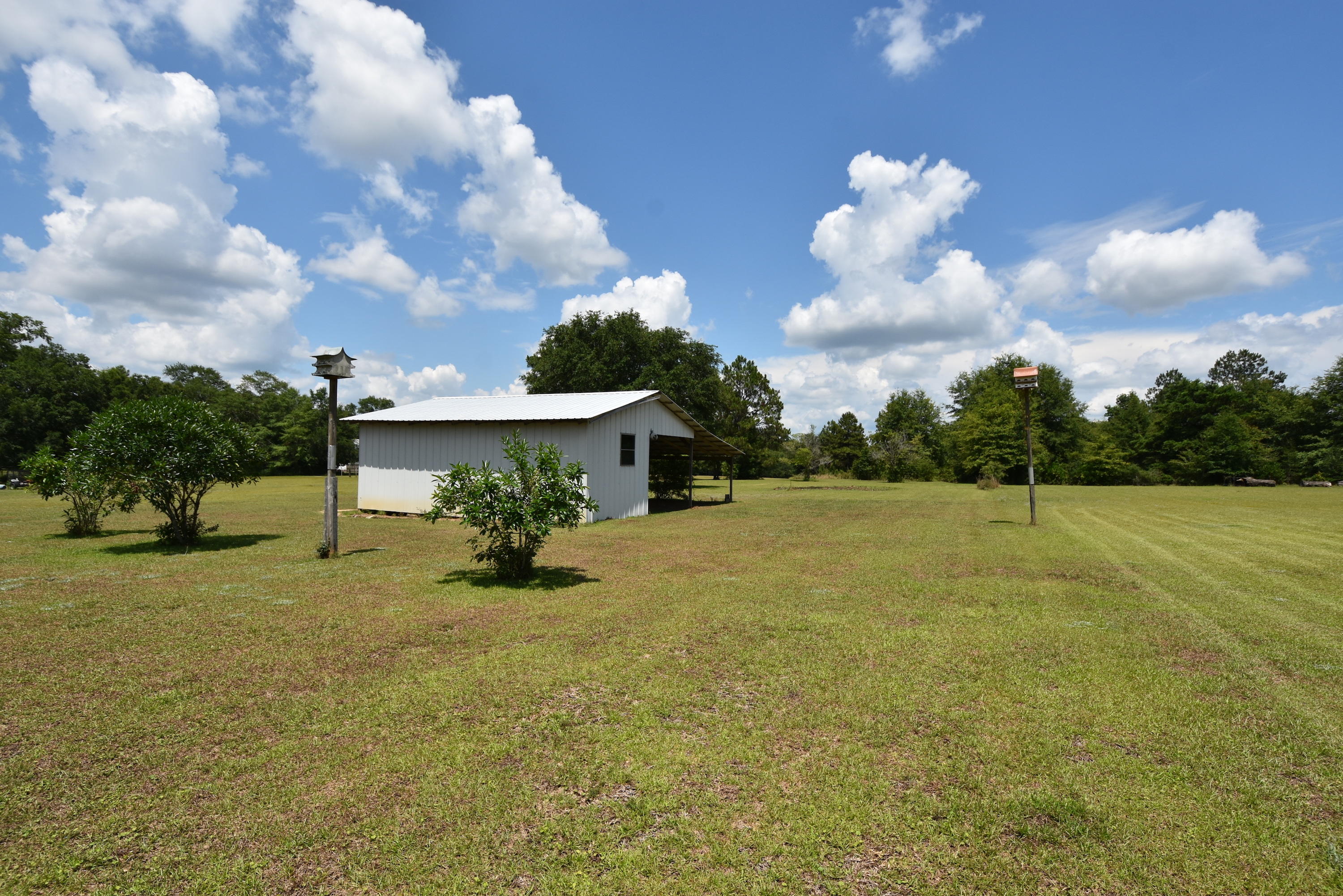 5817 Dairy Road Baker, FL 32531 - Photo 29 of 36 a view of a house with a yard