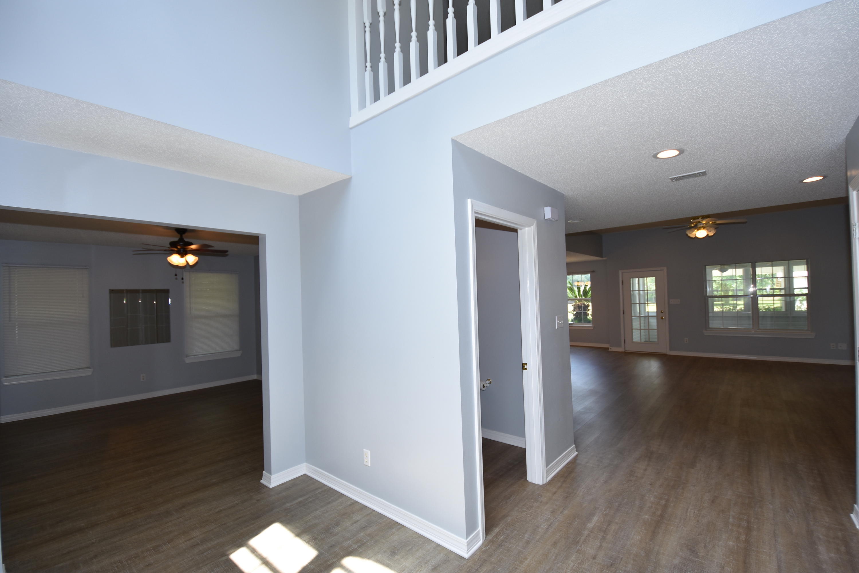 5817 Dairy Road Baker, FL 32531 - Photo 3 of 36 wooden floor in an empty room with a window