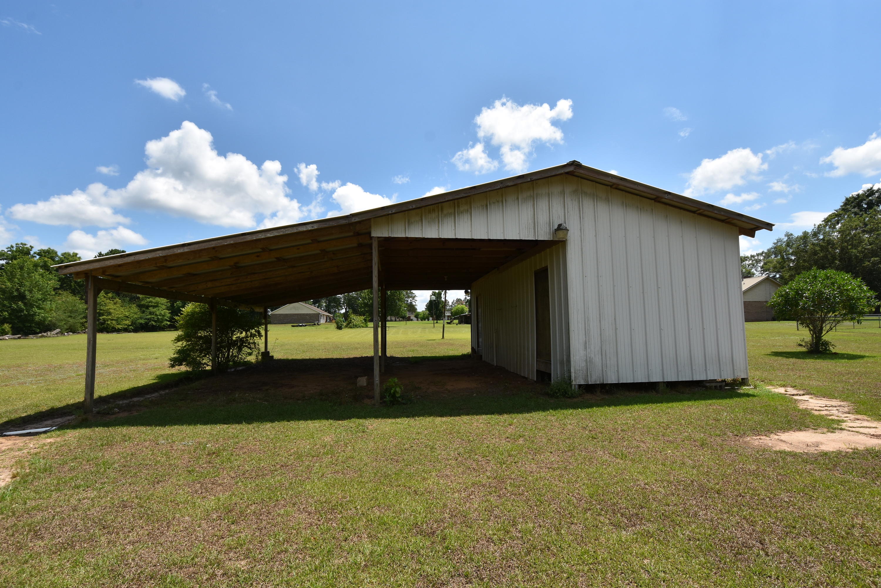 5817 Dairy Road Baker, FL 32531 - Photo 31 of 36 a backyard of a house with table and chairs