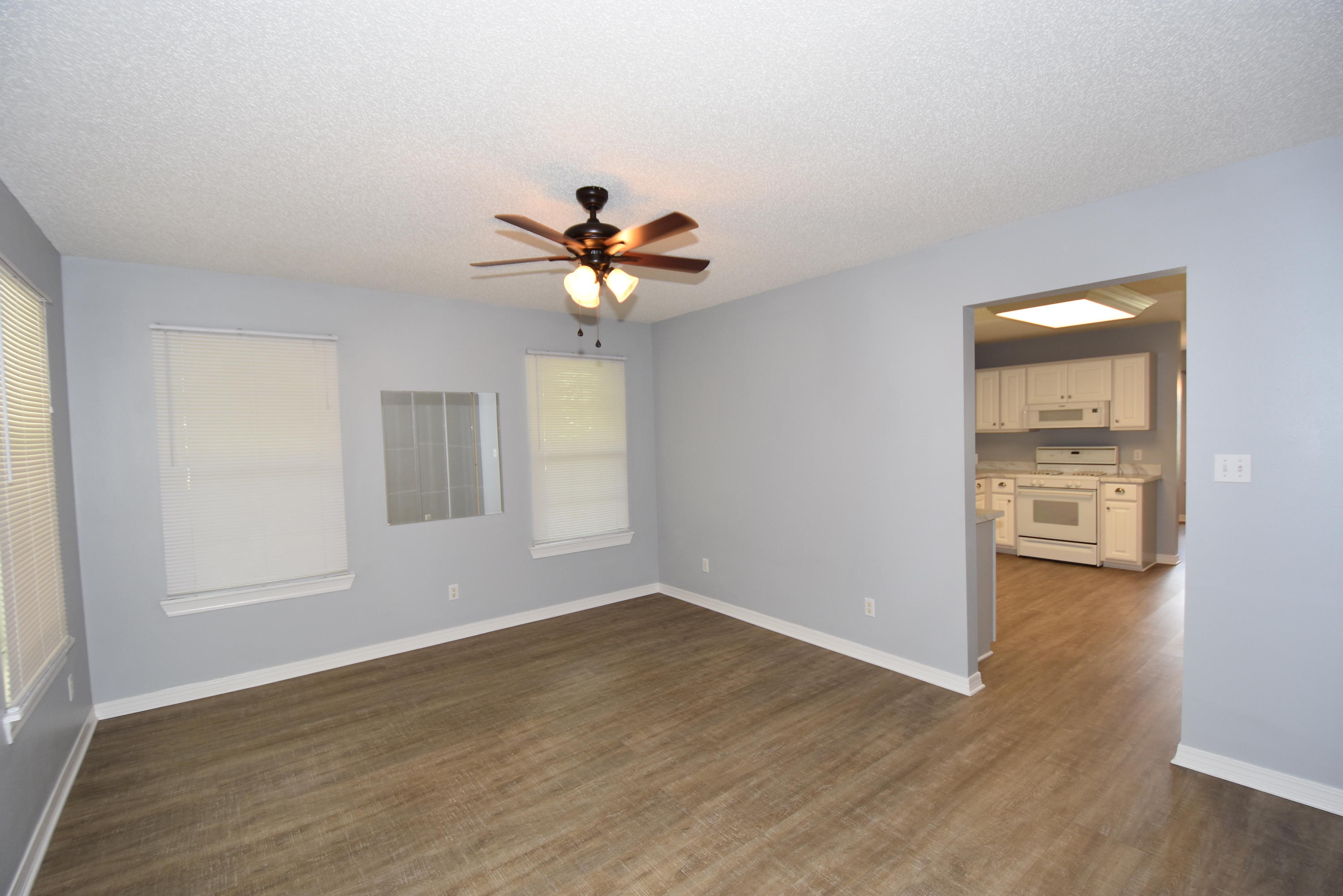 5817 Dairy Road Baker, FL 32531 - Photo 4 of 36 wooden floor in an empty room with a window