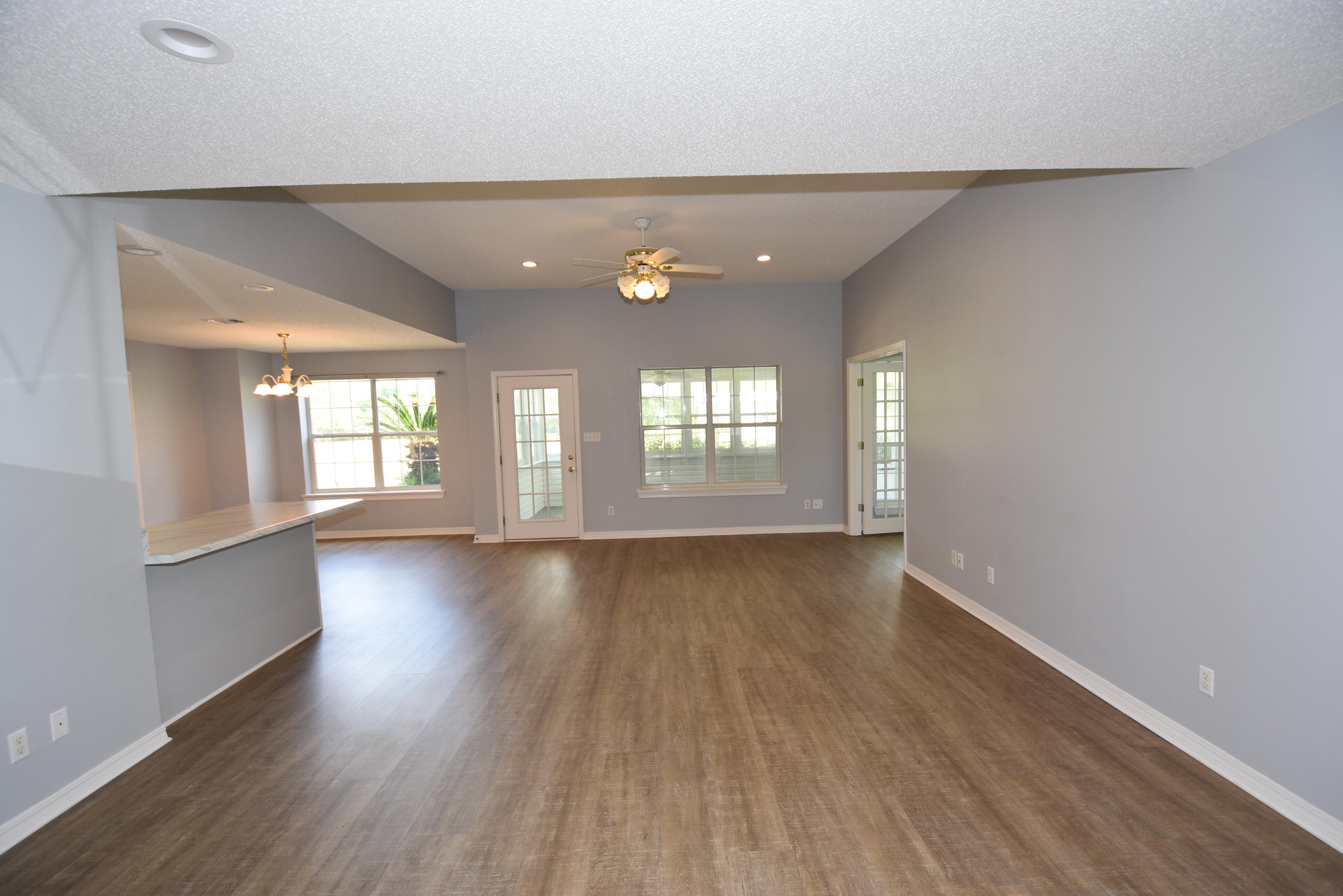 5817 Dairy Road Baker, FL 32531 - Photo 5 of 36 wooden floor in an empty room with a window
