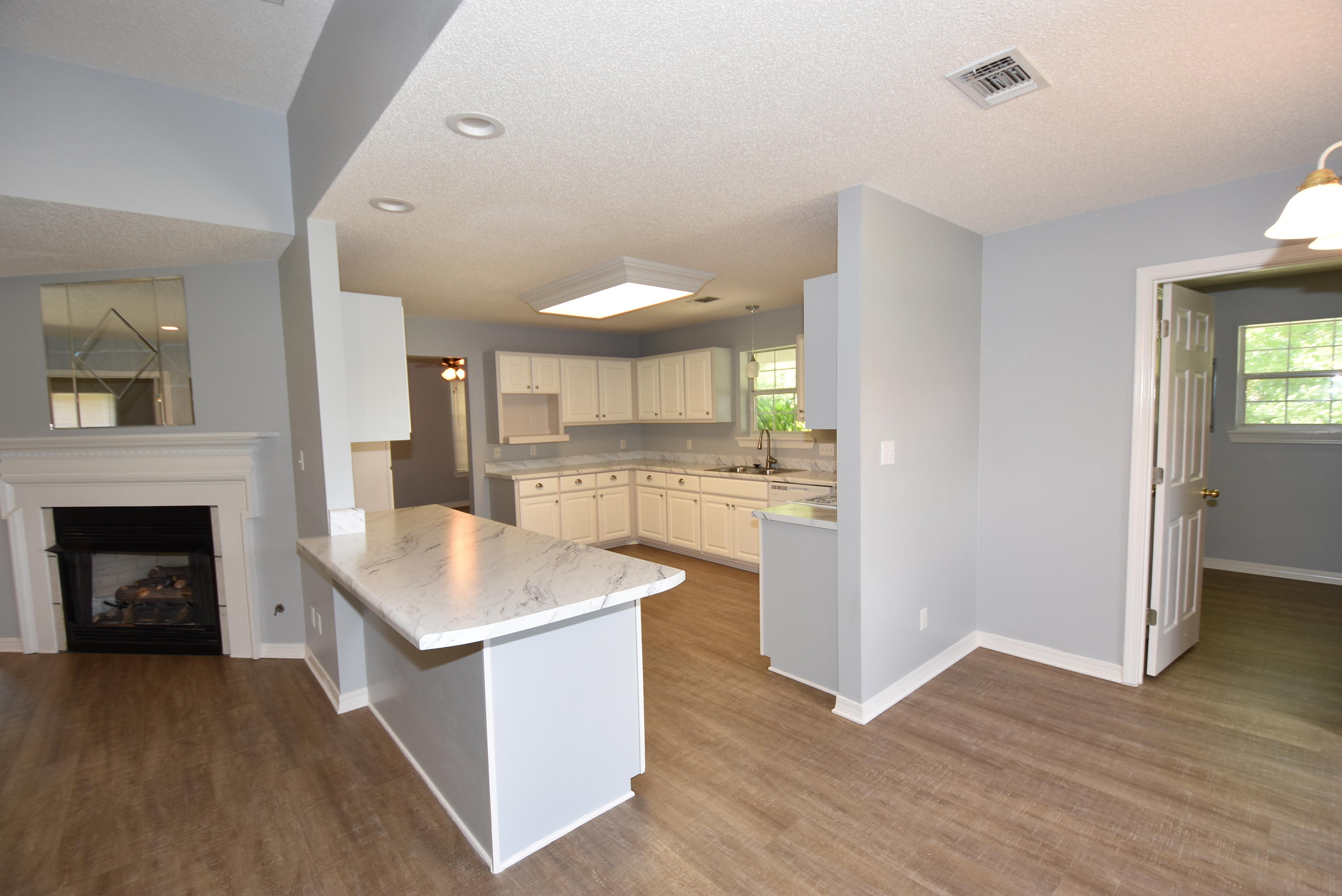 5817 Dairy Road Baker, FL 32531 - Photo 8 of 36 a kitchen with a sink and a fireplace