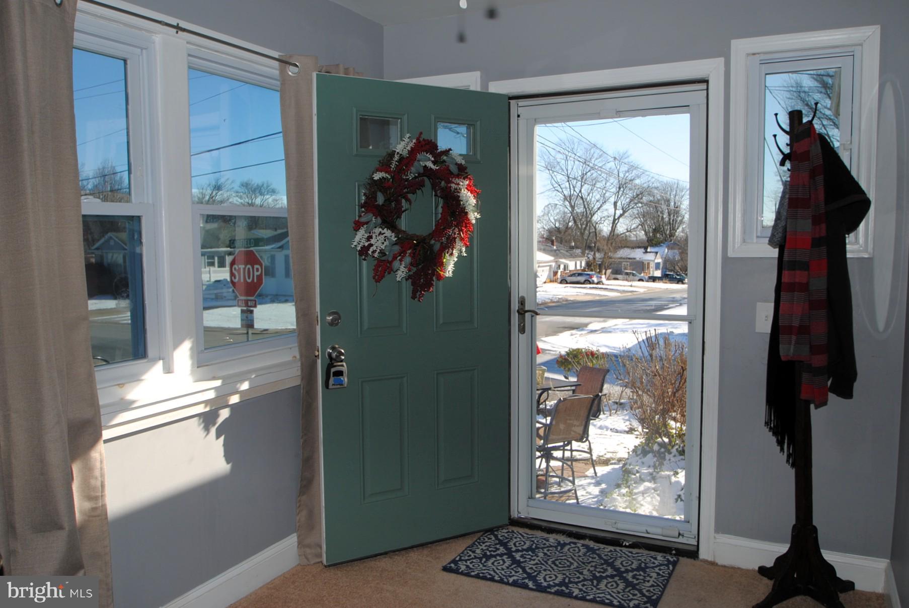 400 West Holly Oak Road Wilmington, DE 19809 - Photo 9 of 60 Porch sunroom view to main entrance