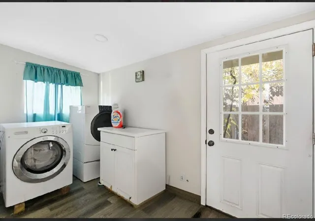 a utility room with sink dryer and washer