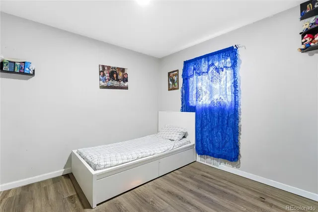 a view of a room with a painting on the wall