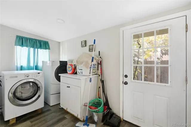 a view of a bedroom with washer and dryer