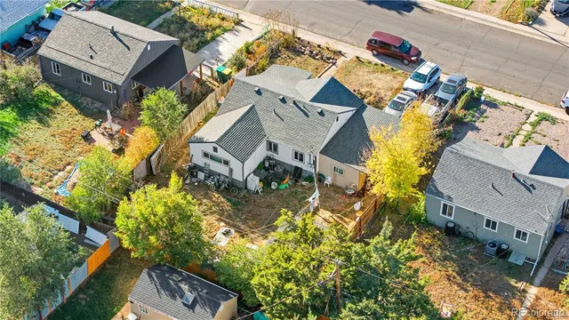 an aerial view of a house with a yard and garden
