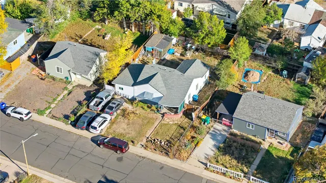 an aerial view of residential house with outdoor space and parking