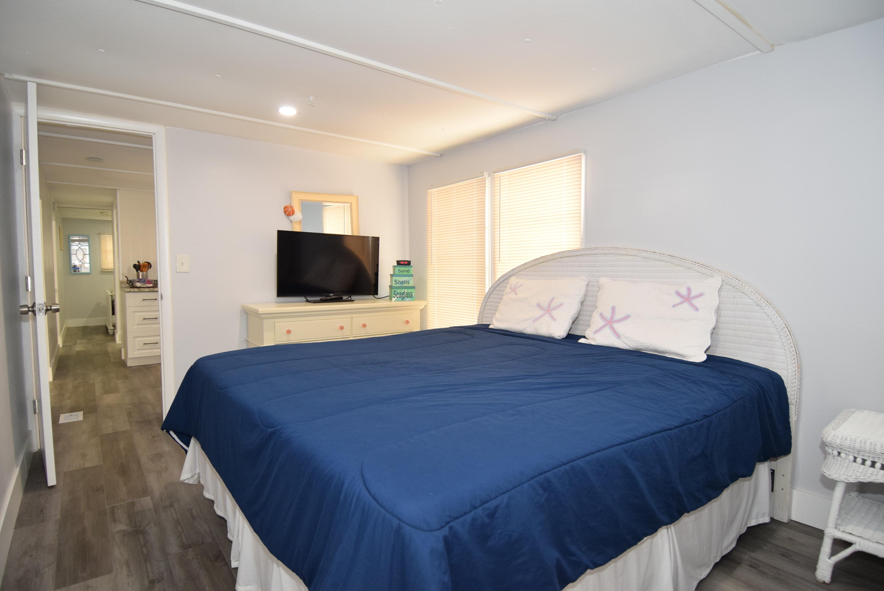 110 Tweedy Pie Terrace Key Largo, FL 33037 - Photo 11 of 21 a bedroom with a bed and a flat screen tv