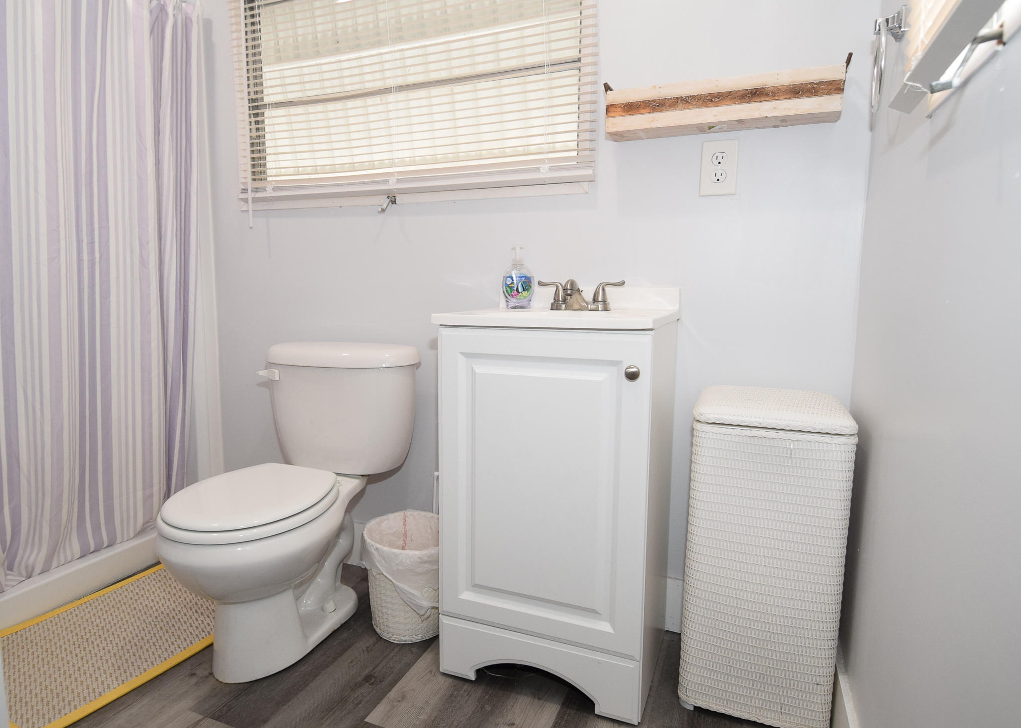 110 Tweedy Pie Terrace Key Largo, FL 33037 - Photo 12 of 21 a white toilet sitting next to a bathroom sink