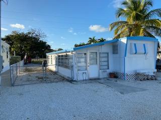 110 Tweedy Pie Terrace Key Largo, FL 33037 - Photo 18 of 21 a view of a entrance gate of a house