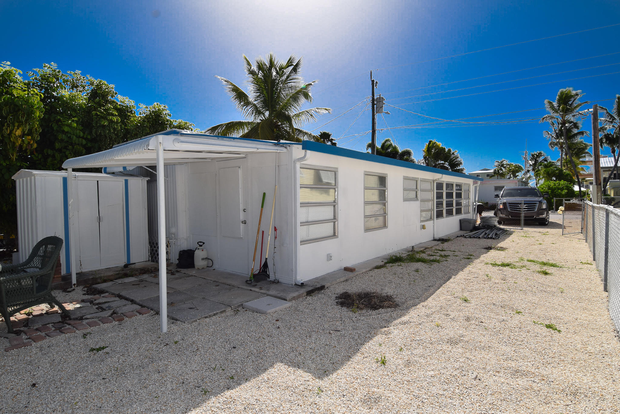 110 Tweedy Pie Terrace Key Largo, FL 33037 - Photo 19 of 21 a white house with tree in front of it