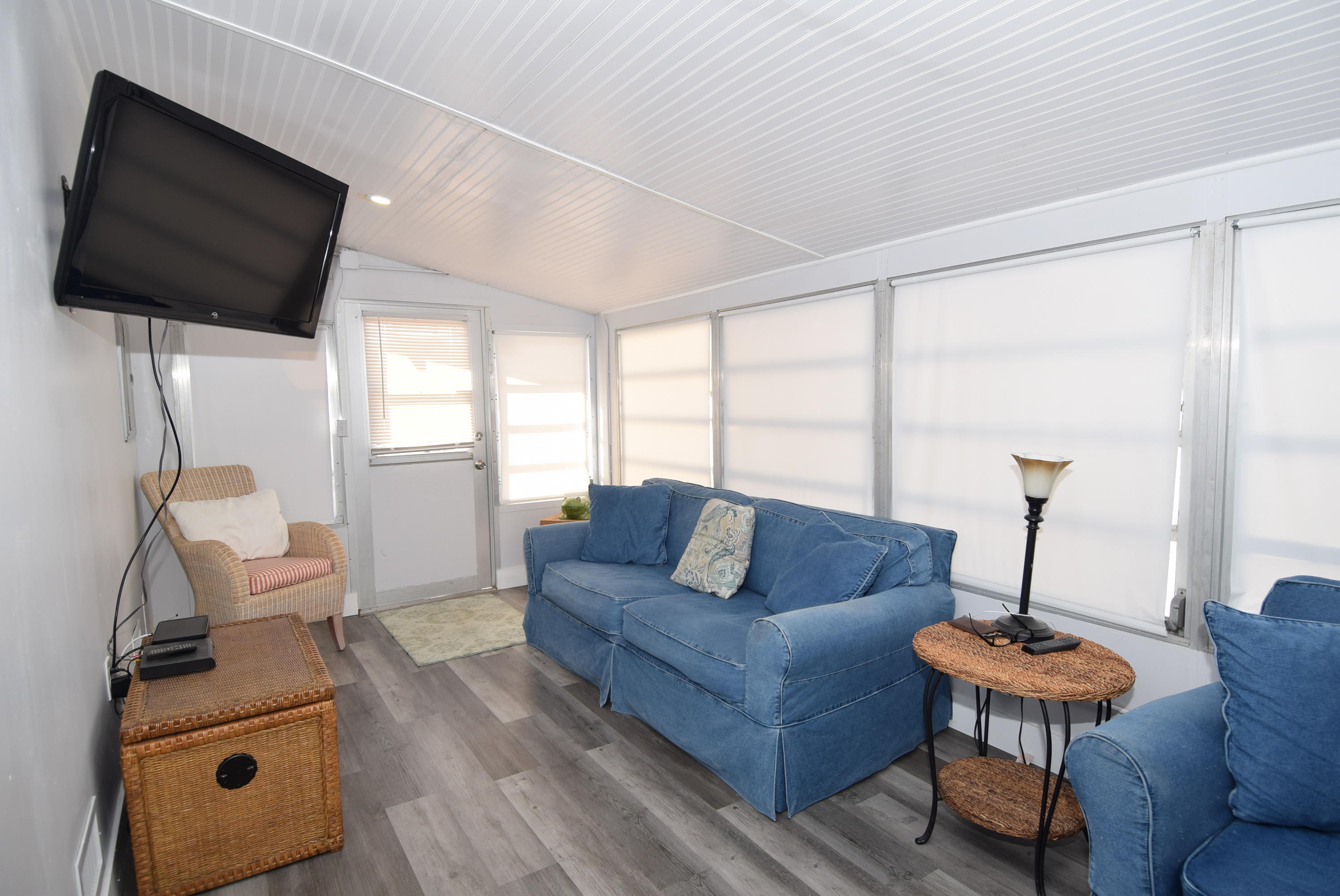 110 Tweedy Pie Terrace Key Largo, FL 33037 - Photo 7 of 21 a living room with furniture and a flat screen tv