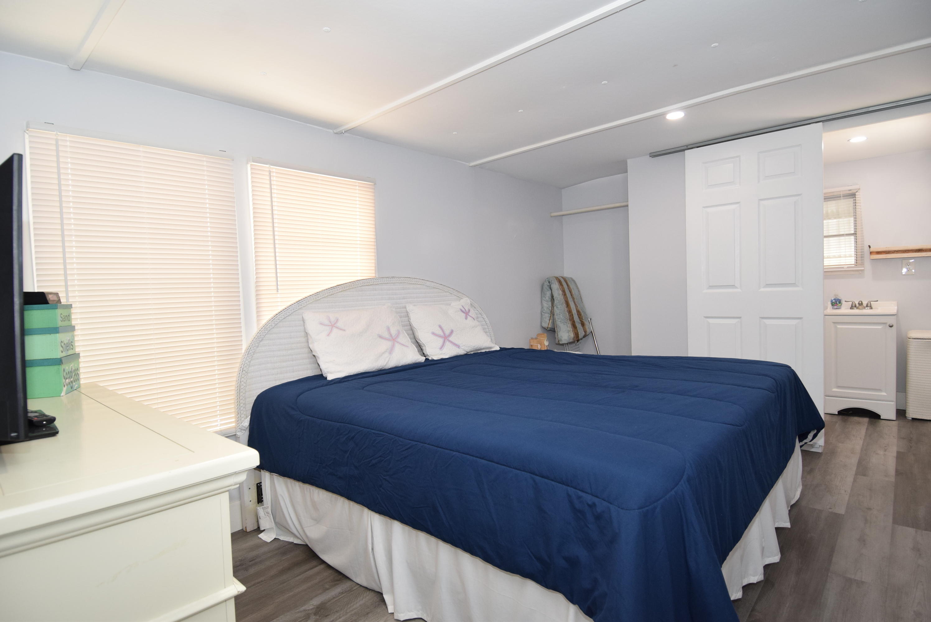 110 Tweedy Pie Terrace Key Largo, FL 33037 - Photo 10 of 21 a bedroom with a bed and a flat tv screen