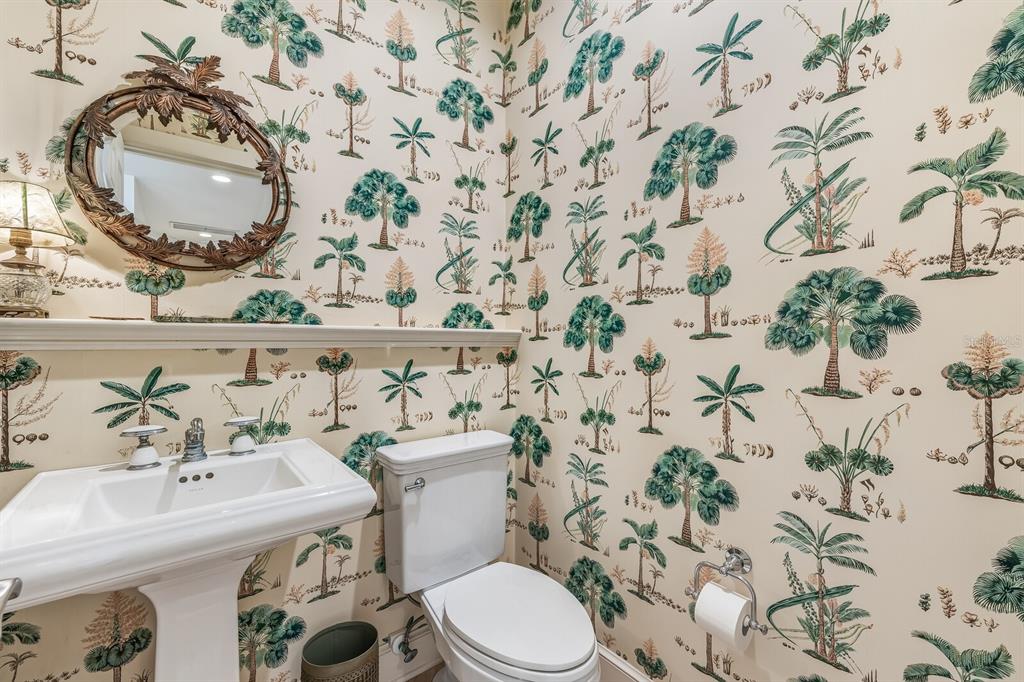 1601 Jean Lafitte Drive Boca Grande, FL 33921 - Photo 12 of 54 a bathroom with a sink and mirror with toilet