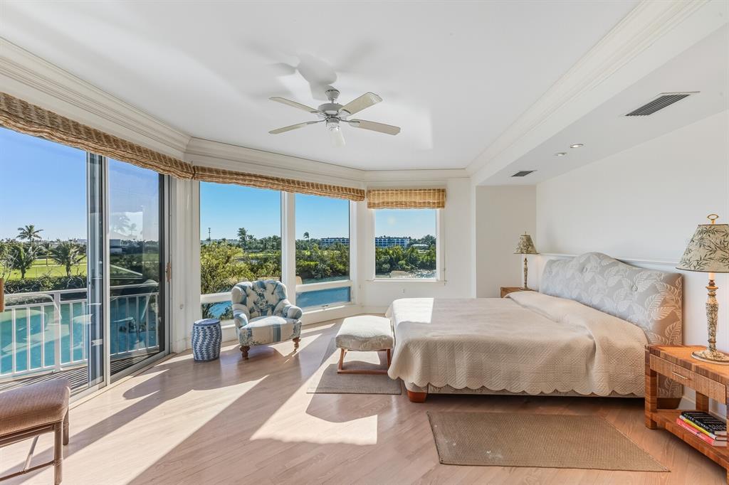 1601 Jean Lafitte Drive Boca Grande, FL 33921 - Photo 26 of 54 a bedroom with a bed and glass window