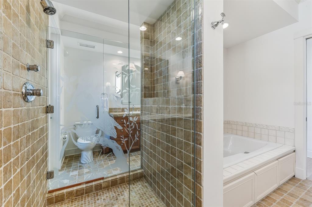 1601 Jean Lafitte Drive Boca Grande, FL 33921 - Photo 29 of 54 a bathroom with a bathtub and a shower