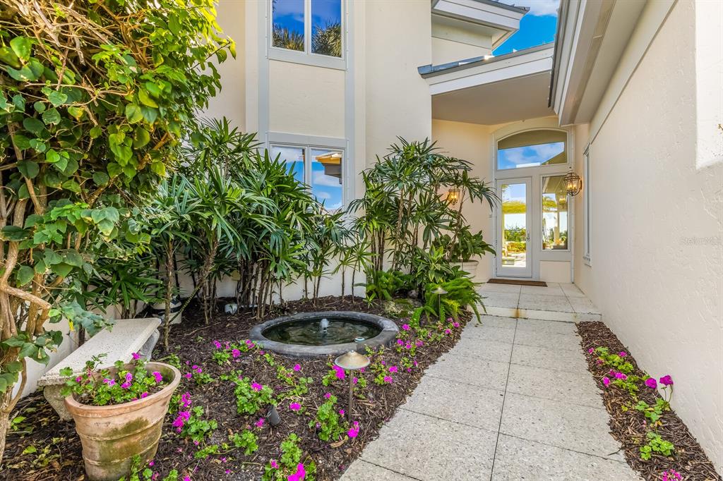 1601 Jean Lafitte Drive Boca Grande, FL 33921 - Photo 3 of 54 a view of a garden with flowers and flowers