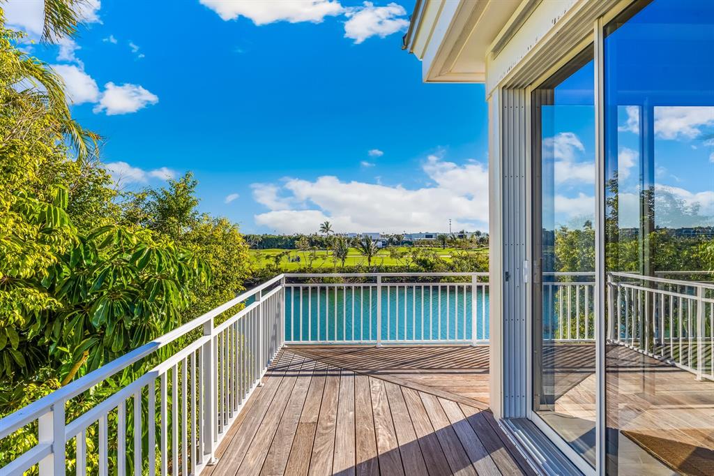 1601 Jean Lafitte Drive Boca Grande, FL 33921 - Photo 32 of 54 a view of a balcony with wooden floor