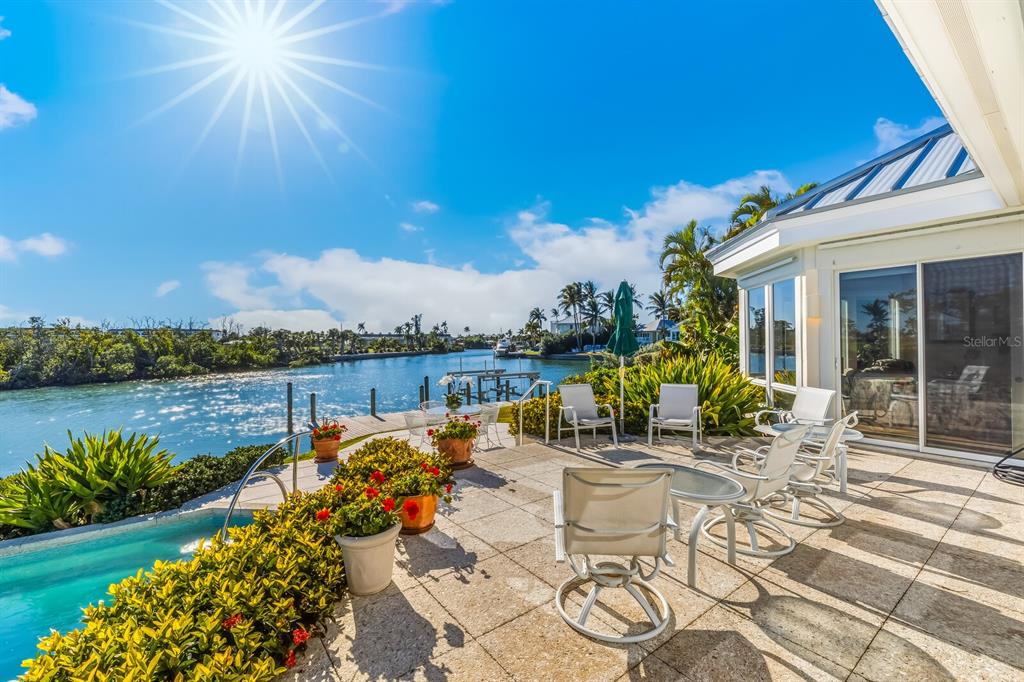 1601 Jean Lafitte Drive Boca Grande, FL 33921 - Photo 37 of 54 a view of a lake with a terrace