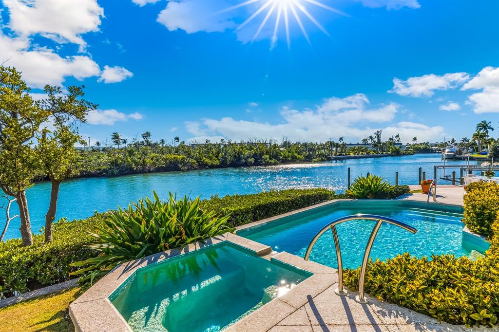 1601 Jean Lafitte Drive Boca Grande, FL 33921 - Photo 39 of 54 a view of a swimming pool and lounge chair