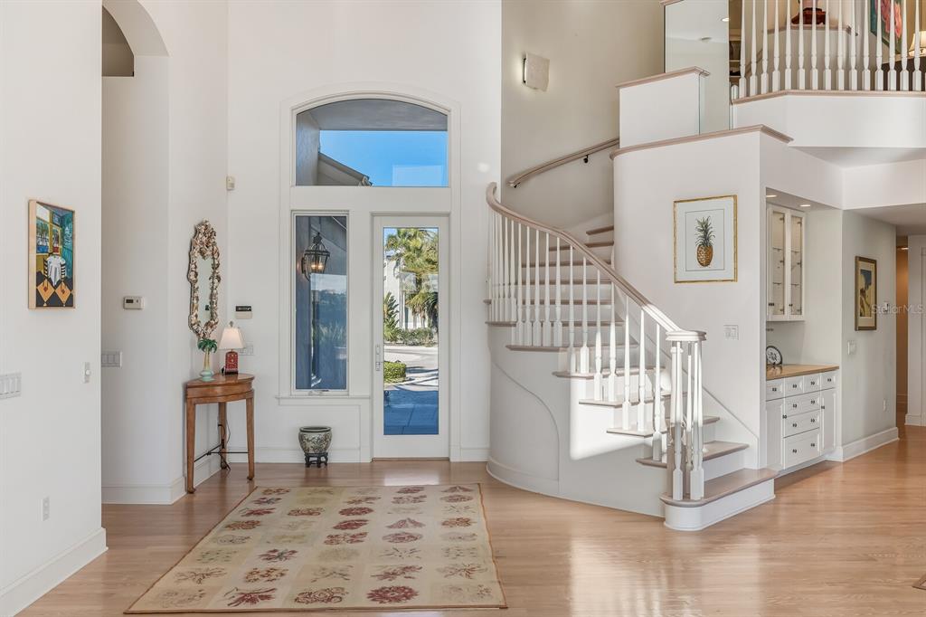 1601 Jean Lafitte Drive Boca Grande, FL 33921 - Photo 4 of 54 view of an entryway with wooden floor and a livingroom