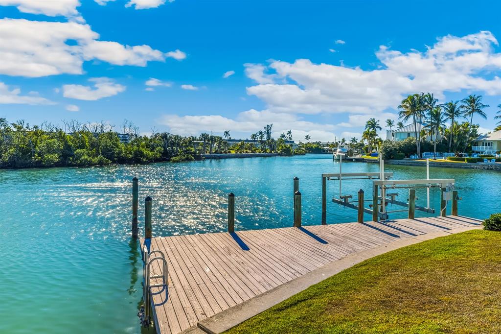 1601 Jean Lafitte Drive Boca Grande, FL 33921 - Photo 42 of 54 a view of a lake with a garden