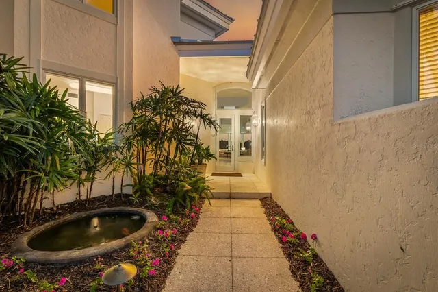 a view of a lake with houses in the background