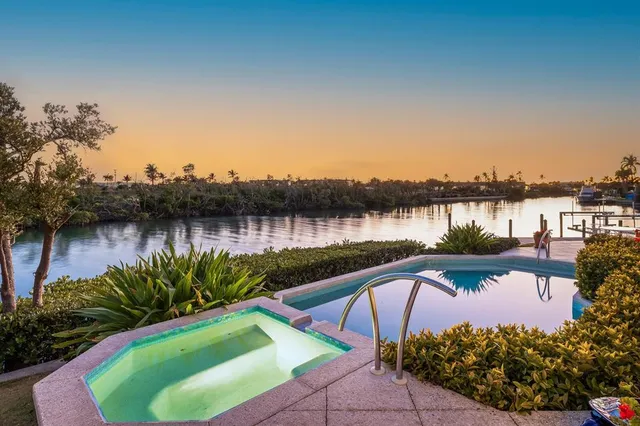 a view of a house next to a lake view