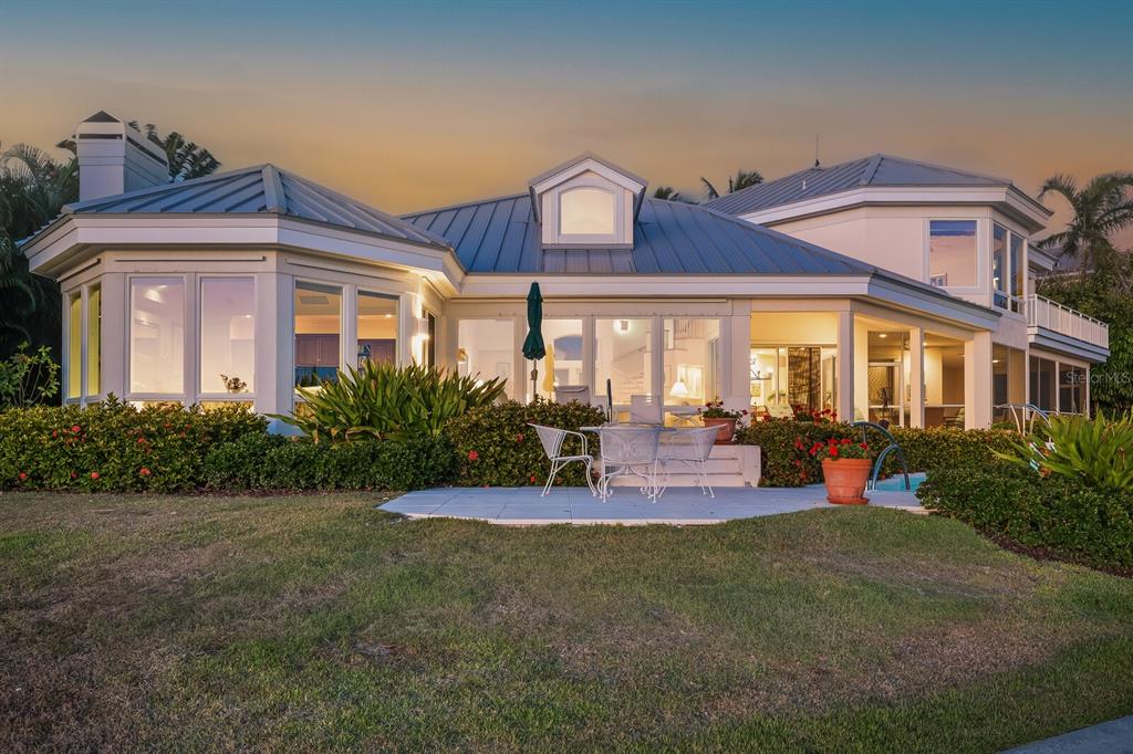 1601 Jean Lafitte Drive Boca Grande, FL 33921 - Photo 54 of 54 a view of a big house with a big yard and plants