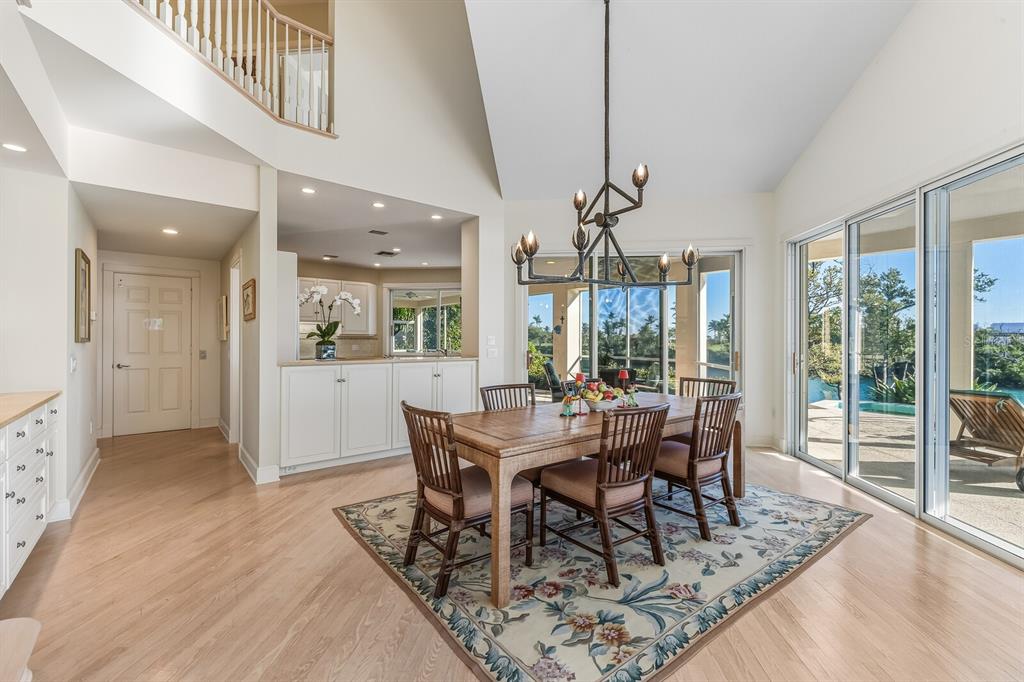 1601 Jean Lafitte Drive Boca Grande, FL 33921 - Photo 8 of 54 a view of a dining room with furniture window and wooden floor