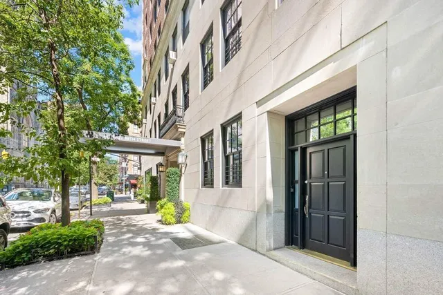 a large white kitchen with a large window