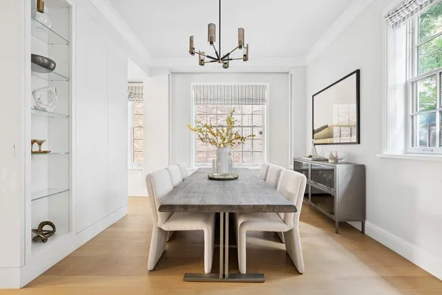 a view of a kitchen with a table and chairs