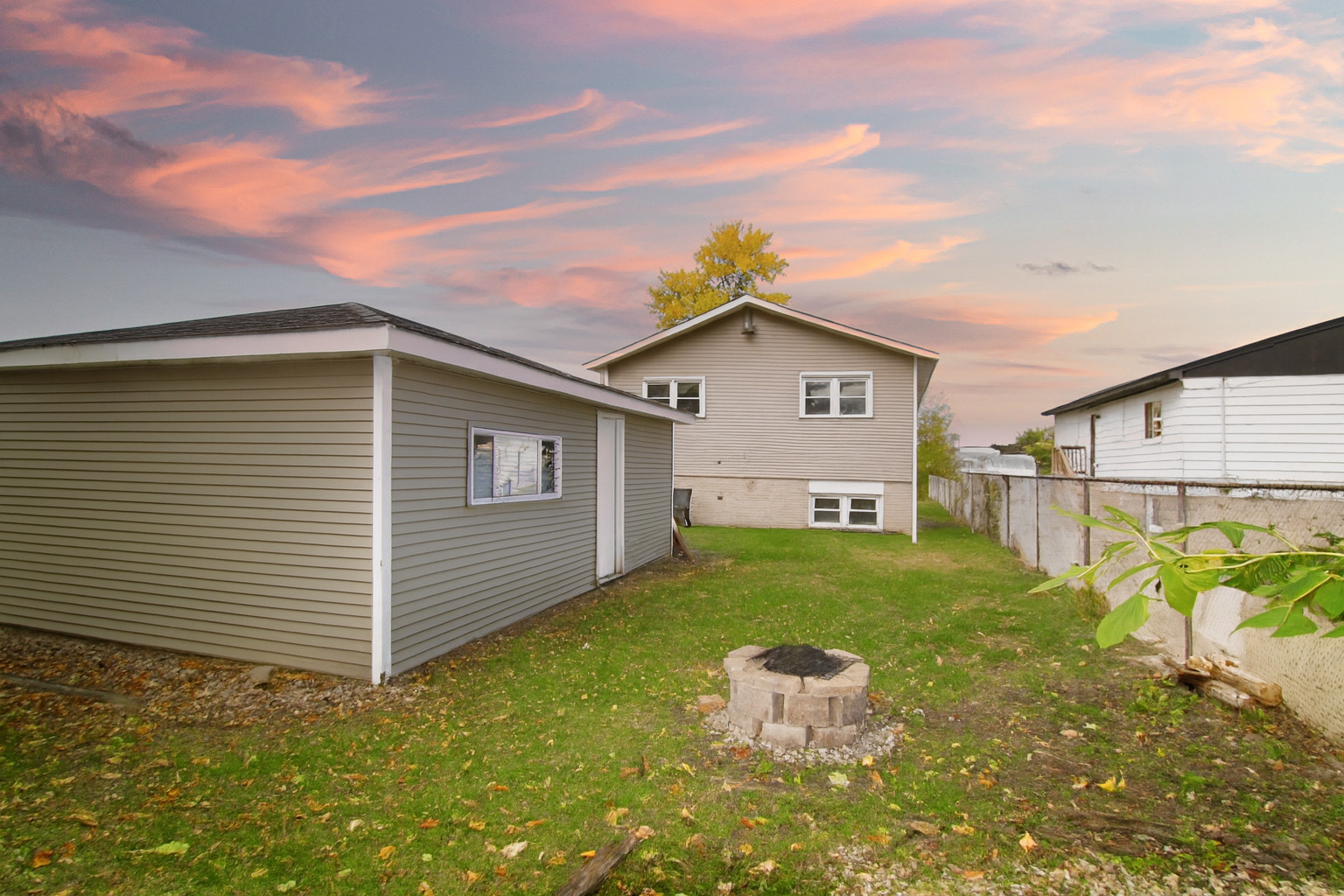 16637 Paulina Street Markham, IL 60428 - Photo 16 of 20 a front view of a house with garden