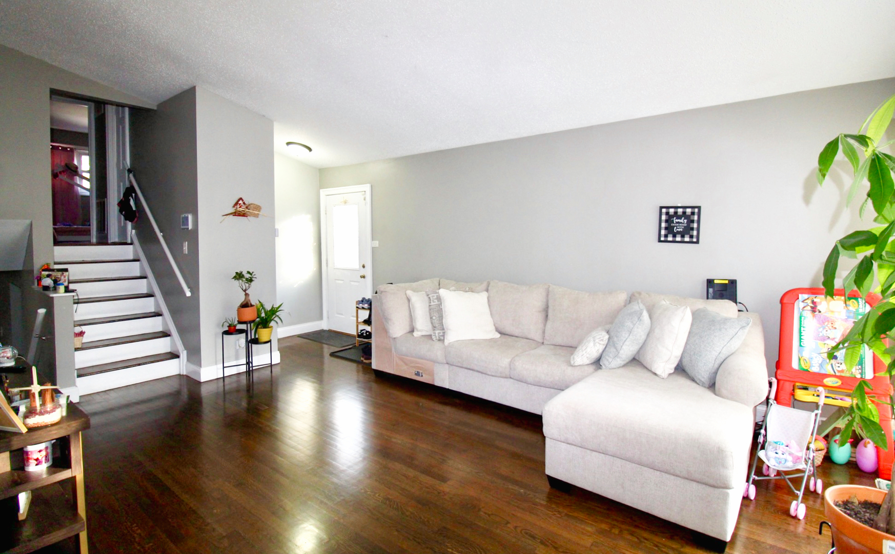 16637 Paulina Street Markham, IL 60428 - Photo 3 of 20 a living room with furniture and a wooden floor