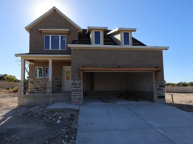 a front view of a house with yard
