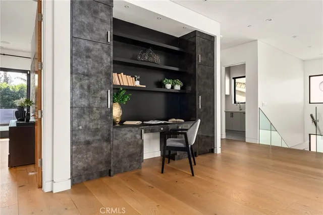 a workspace with furniture and wooden floor