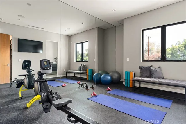 a bathroom with a granite countertop sink a mirror and a shower