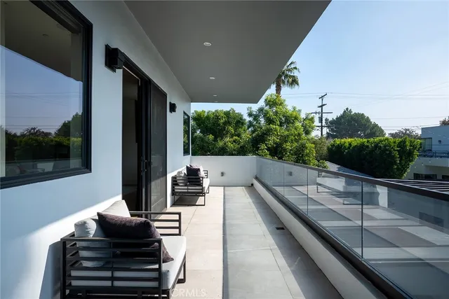 a view of house with a swimming pool outdoor seating