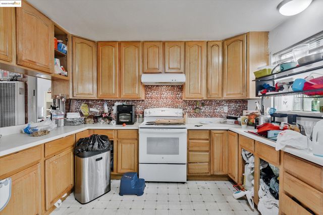 a view of a kitchen with appliances and cabinets