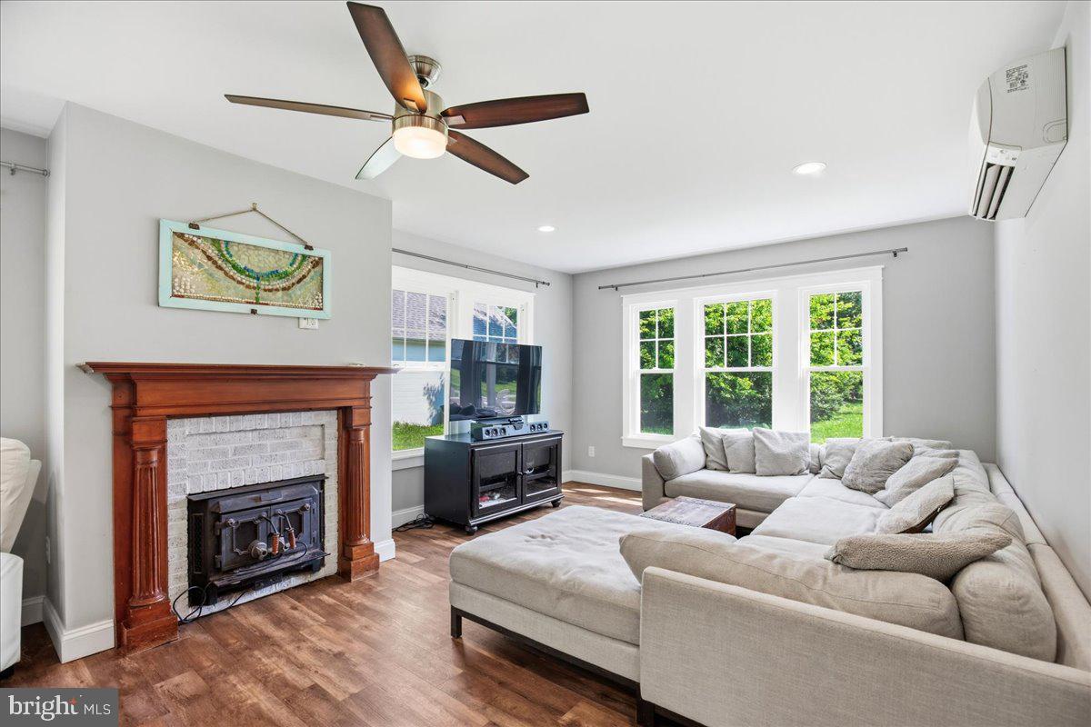 16146 Thomas Road Piney Point, MD 20674 - Photo 31 of 70 a living room with furniture and a fireplace