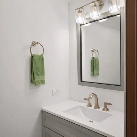a bathroom with a sink and mirror