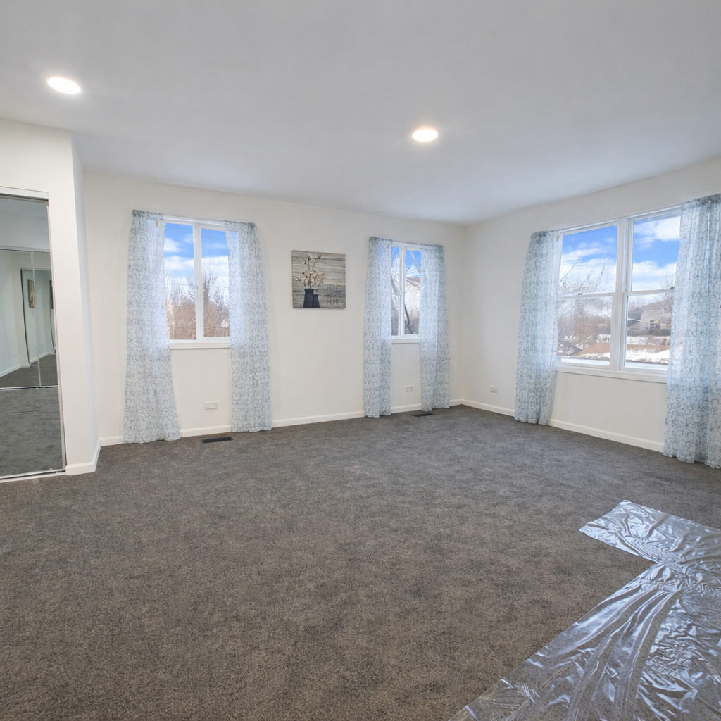 628 Mohawk Drive Round Lake Heights, IL 60073 - Photo 6 of 14 a view of an empty room with a window
