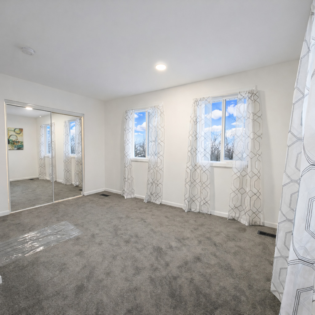 628 Mohawk Drive Round Lake Heights, IL 60073 - Photo 9 of 14 an empty room with windows and closet