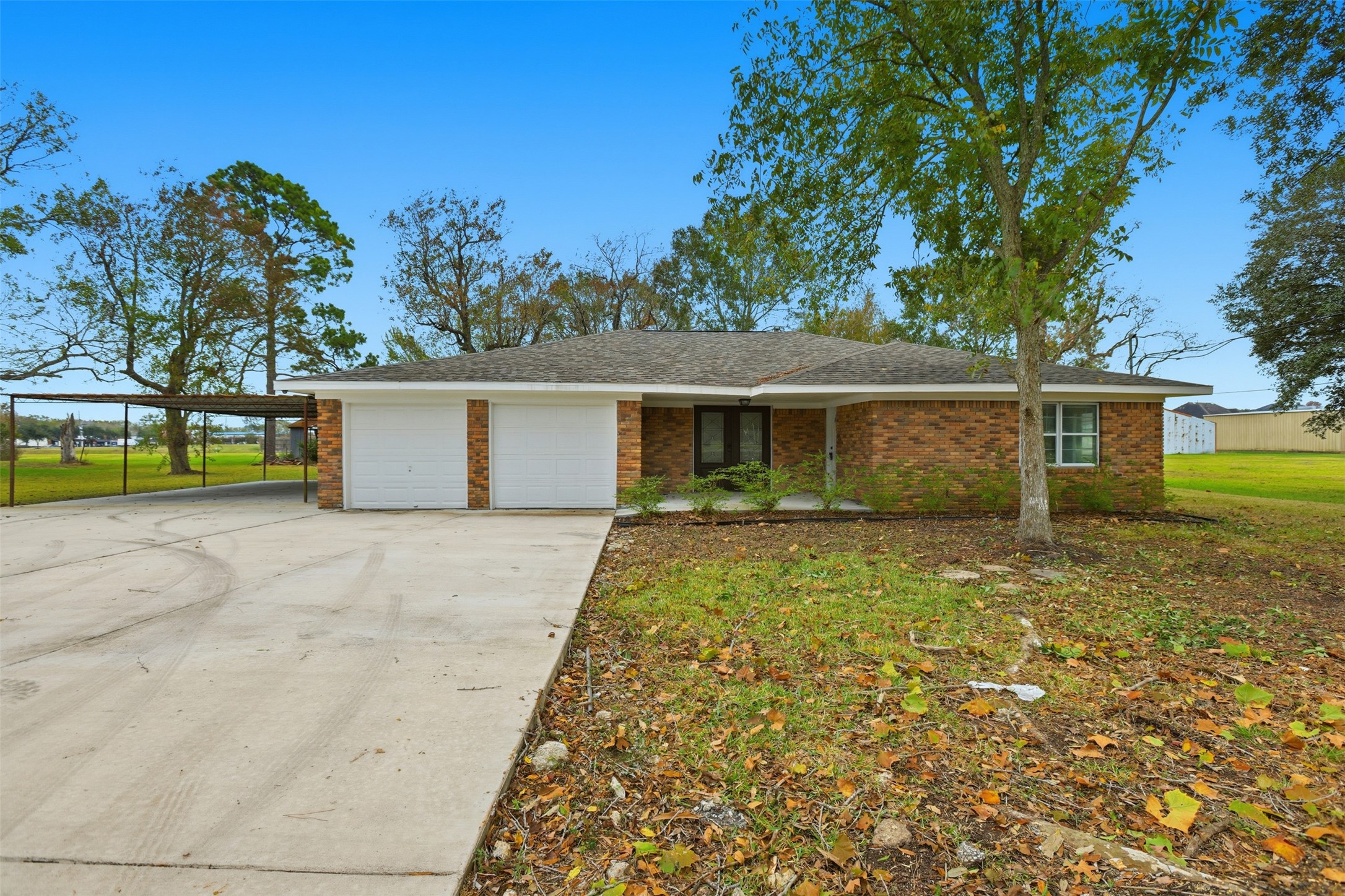 2751 Piper Road Pearland, TX 77581 - Photo 1 of 24 front view of a house with a yard