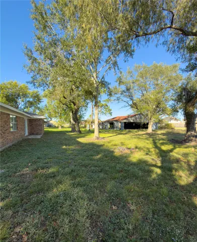 a view of a big yard with swimming pool