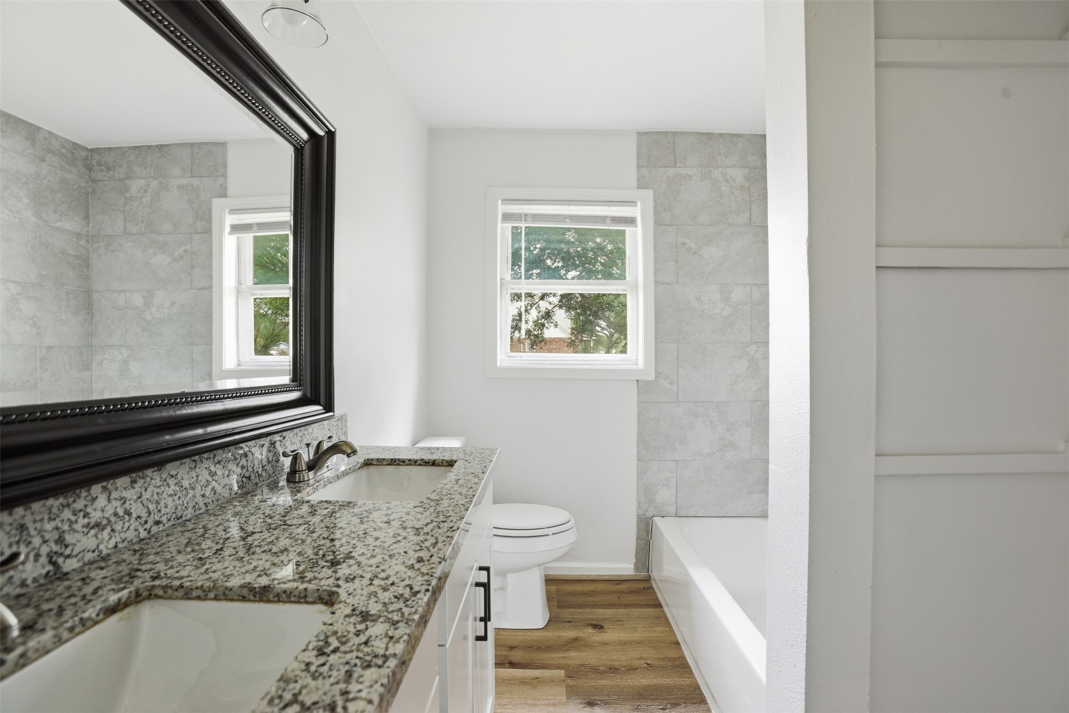 2751 Piper Road Pearland, TX 77581 - Photo 16 of 24 a bathroom with a bathtub and window