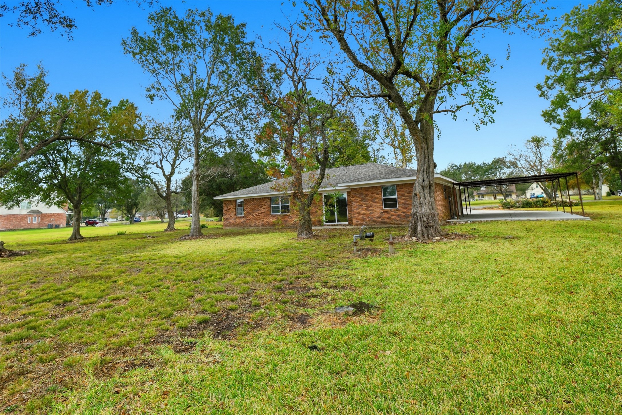 2751 Piper Road Pearland, TX 77581 - Photo 22 of 24 a front view of a house with a yard
