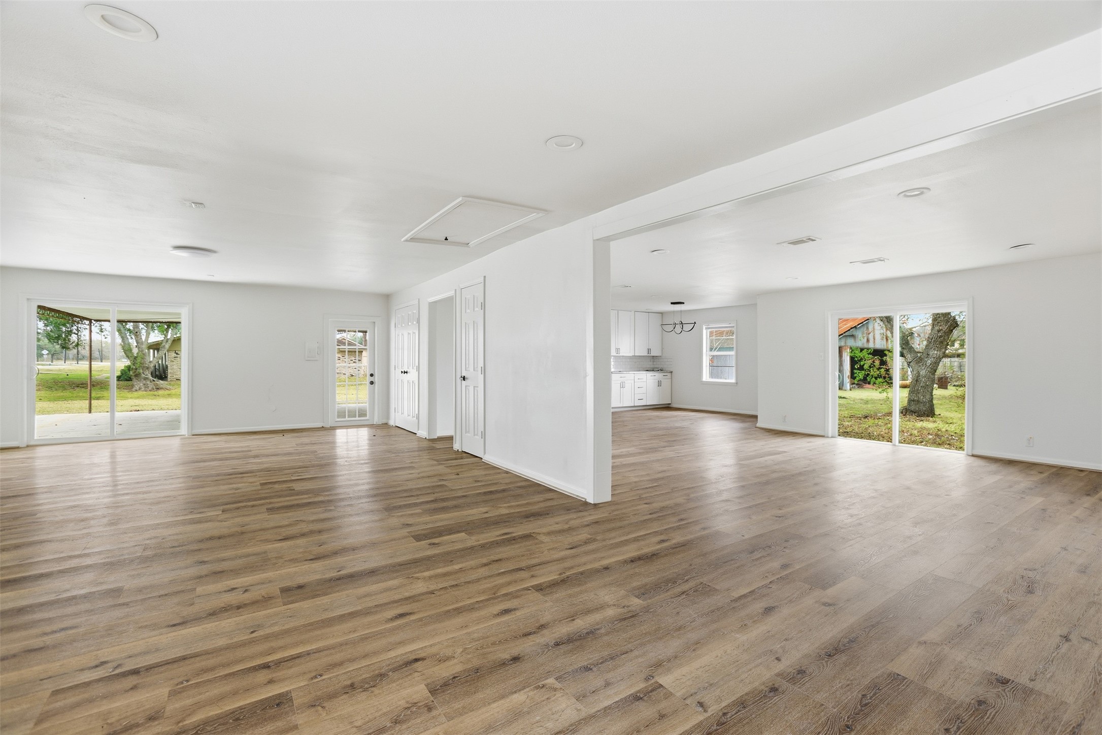 2751 Piper Road Pearland, TX 77581 - Photo 4 of 24 a view of an empty room with window and wooden floor