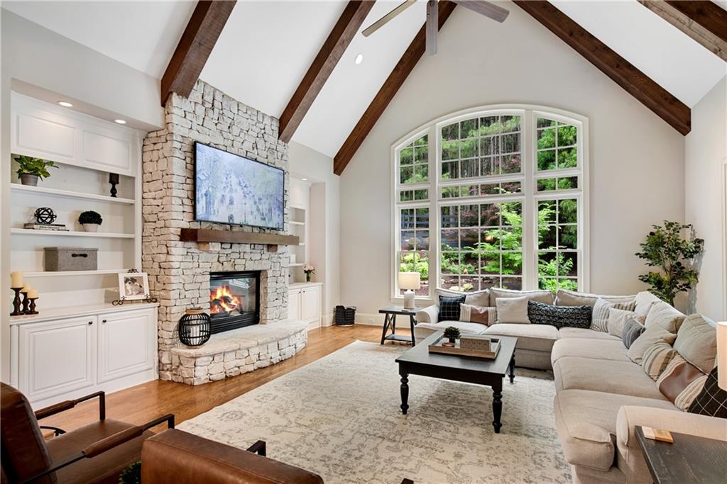 13942 Tree Loft Road Milton, GA 30004 - Photo 23 of 102 a living room with furniture fireplace and a large window